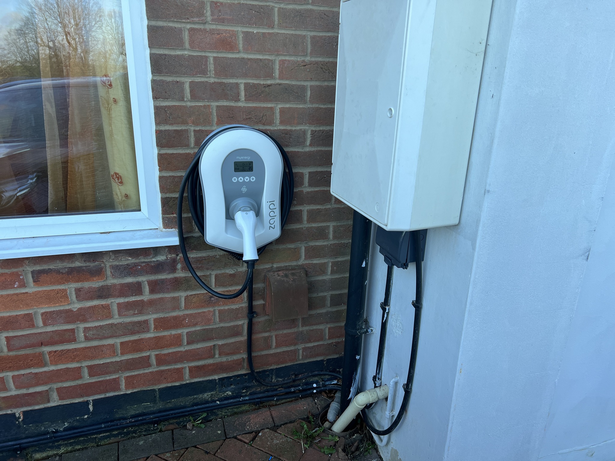 Home EV charger professionally installed by DNA Power Solutions in Corby